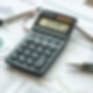 A calculator with financial documents related to real estate